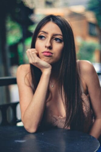 Young, thoughtful woman for brand marketing email