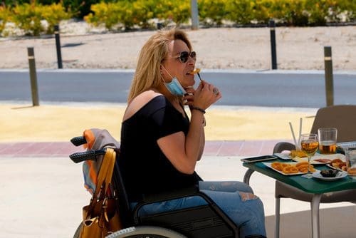 Woman in a wheelchair enjoying winery for accessibility post