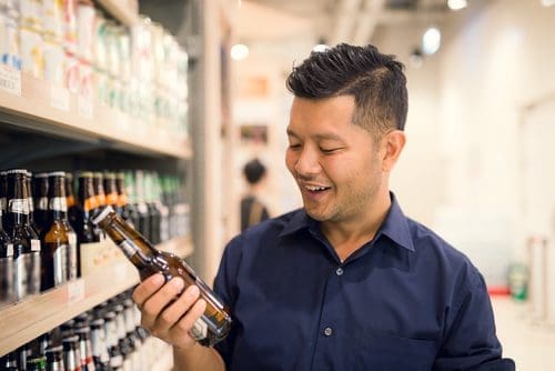 Man shopping for beer photo for craft beverage introduction post