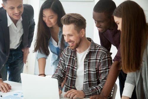 Gathered around computer photo for funding sources post