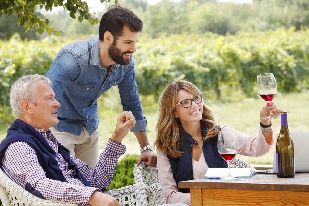 Family reviewing wine for craft beverage introduction post