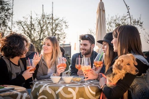 Friends drinking on a patio photo for Artificial Intelligence promo post