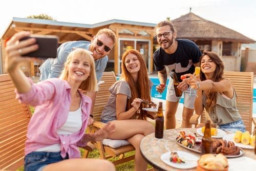 Friends at a backyard party photo for summer toolkit post
