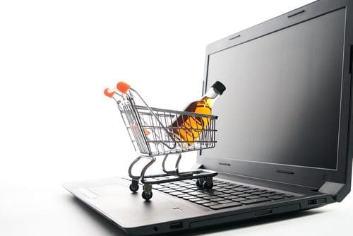 Shopping cart on laptop photo for website versus social post